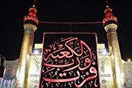 پرچم عزای «فُزْتُ وَ رَبِّ الْکَعْبَه» برفراز ایوان نجف برافراشته شد + عکس و فیلم